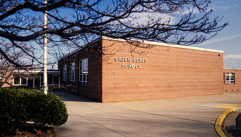 Color photograph of the main entrance of Green Acres Elementary School from a 35 millimeter slide. The date the photograph was taken is unknown.
